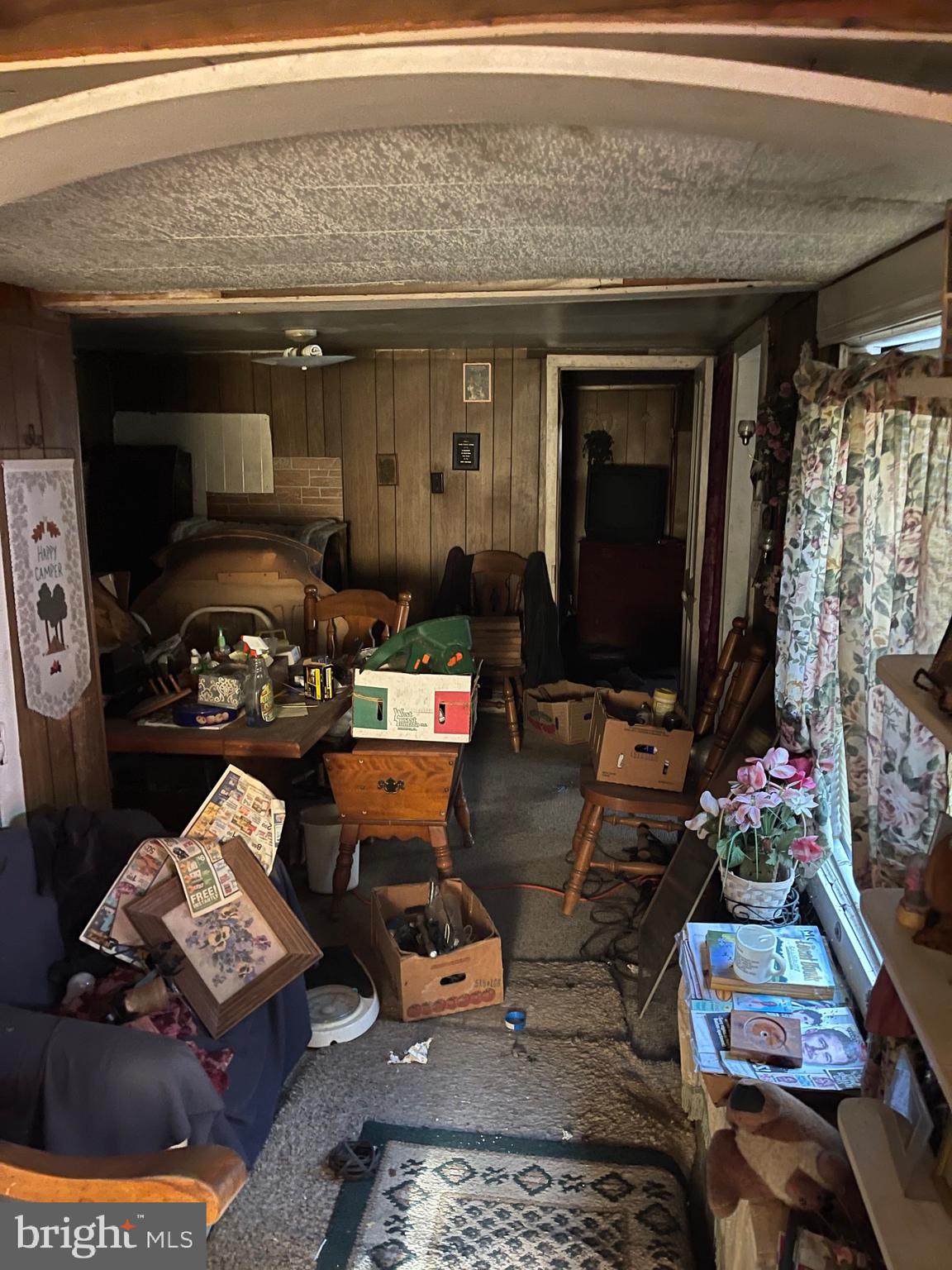 12173 Laurel Road Mardela Springs, MD 21837 - Photo 8 of 11 a living room with furniture and a flat screen tv
