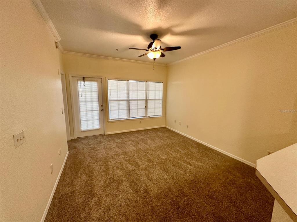 3561 Conroy Road, Unit 215 Orlando, FL 32839 - Photo 17 of 43 a view of an empty room with a window