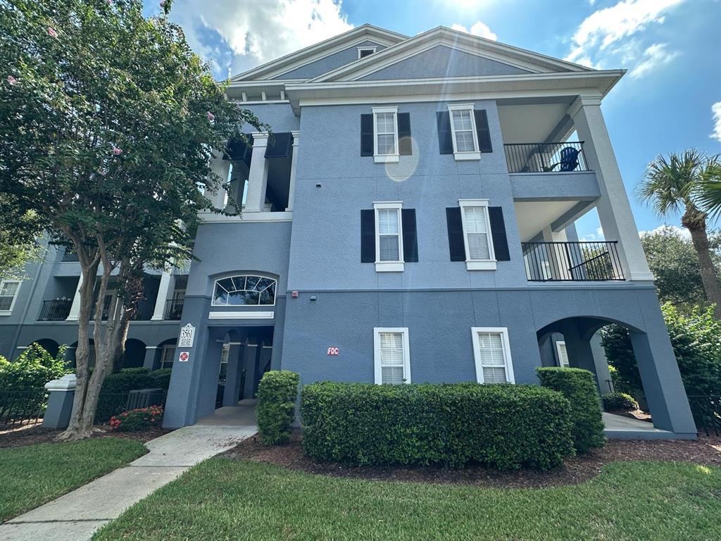3561 Conroy Road, Unit 215 Orlando, FL 32839 - Photo 2 of 43 a front view of a house with a yard
