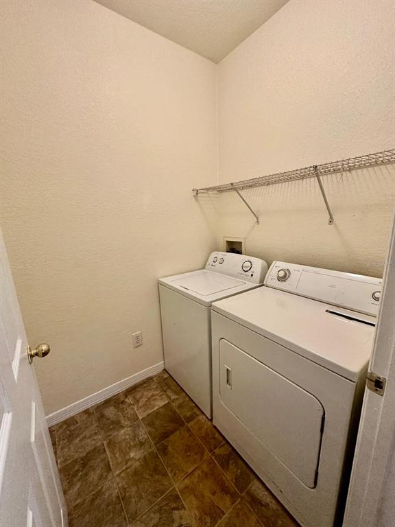 3561 Conroy Road, Unit 215 Orlando, FL 32839 - Photo 27 of 43 a utility room with dryer and washer