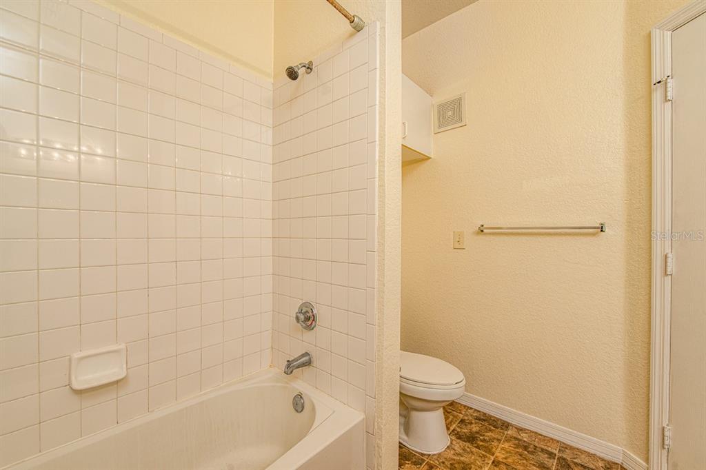 3561 Conroy Road, Unit 215 Orlando, FL 32839 - Photo 28 of 43 a bathroom with a bathtub and a toilet