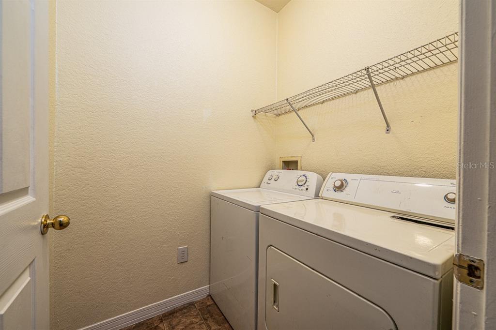 3561 Conroy Road, Unit 215 Orlando, FL 32839 - Photo 29 of 43 a utility room with dryer and washer