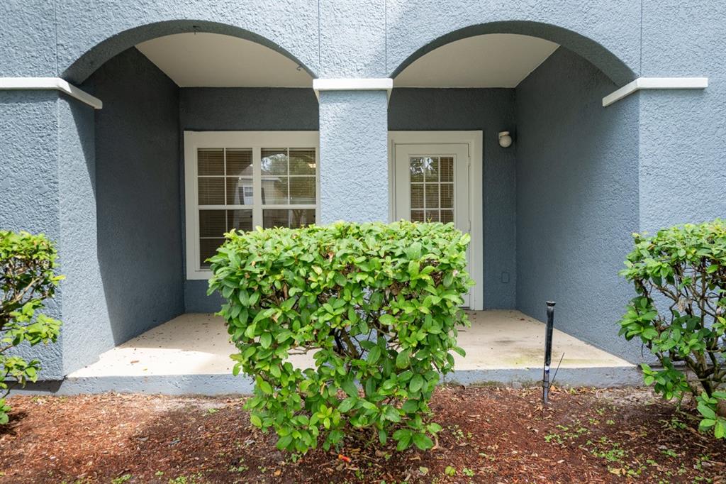 3561 Conroy Road, Unit 215 Orlando, FL 32839 - Photo 31 of 43 a house view with a garden space