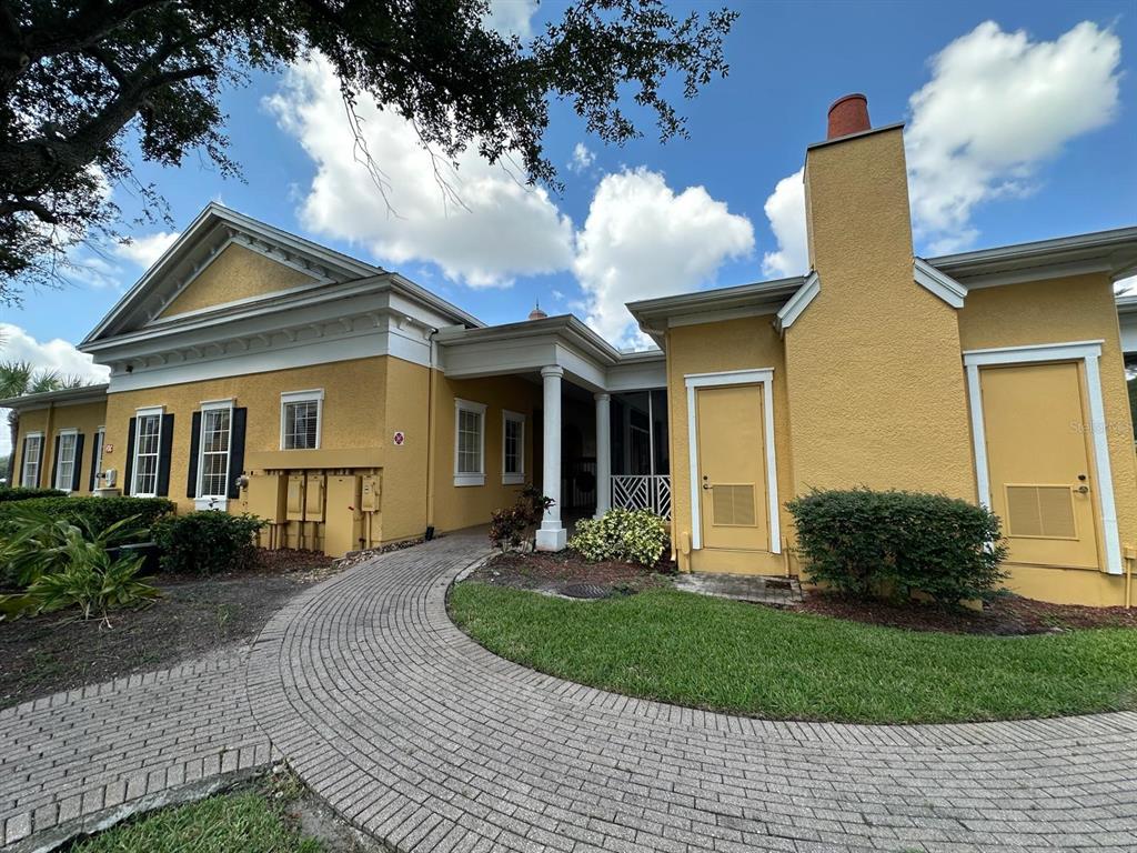 3561 Conroy Road, Unit 215 Orlando, FL 32839 - Photo 41 of 43 a front view of a house with garden