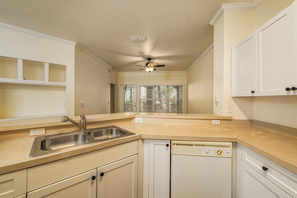 3561 Conroy Road, Unit 215 Orlando, FL 32839 - Photo 5 of 43 a kitchen with a sink and a window