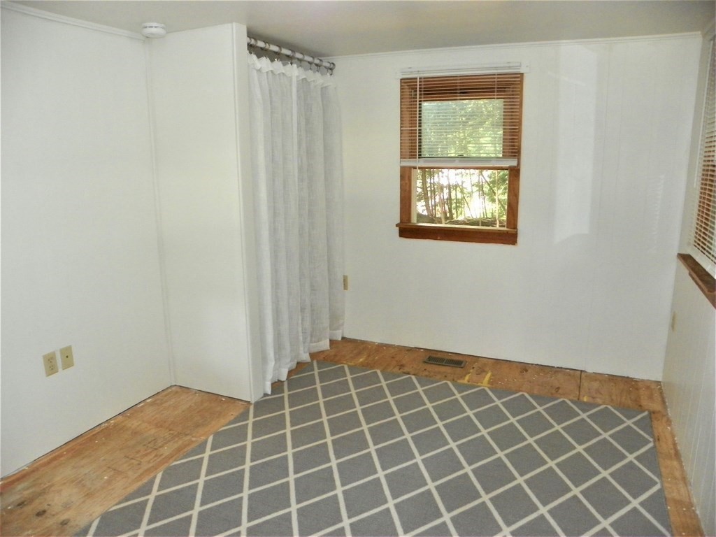 9 Crescent Road Winchendon, MA 01475 - Photo 21 of 23 a view of an empty room with wooden floor and a window