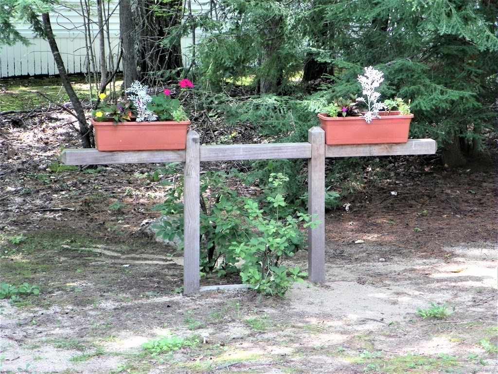 9 Crescent Road Winchendon, MA 01475 - Photo 5 of 23 a view of a wooden bench sitting in a yard