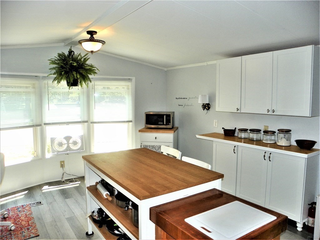 9 Crescent Road Winchendon, MA 01475 - Photo 8 of 23 a kitchen with a stove a sink and a refrigerator