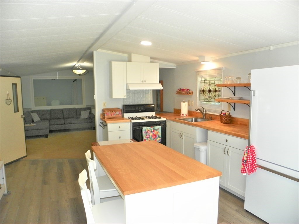 9 Crescent Road Winchendon, MA 01475 - Photo 9 of 23 a kitchen with a sink appliances and cabinets