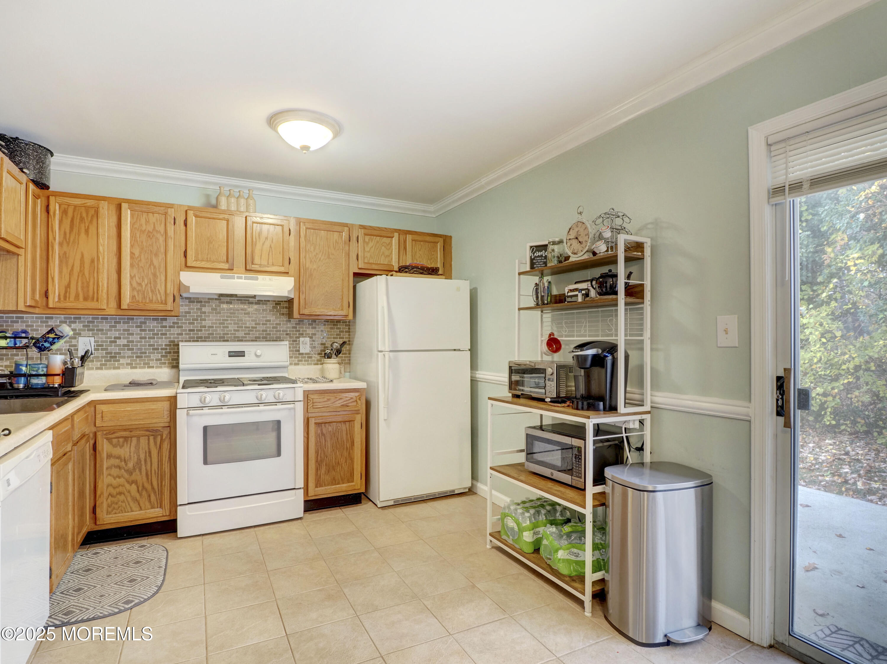 82 Cliffwood Avenue West, Unit 25D Cliffwood, NJ 07721 - Photo 16 of 27 a kitchen with a stove top oven and refrigerator
