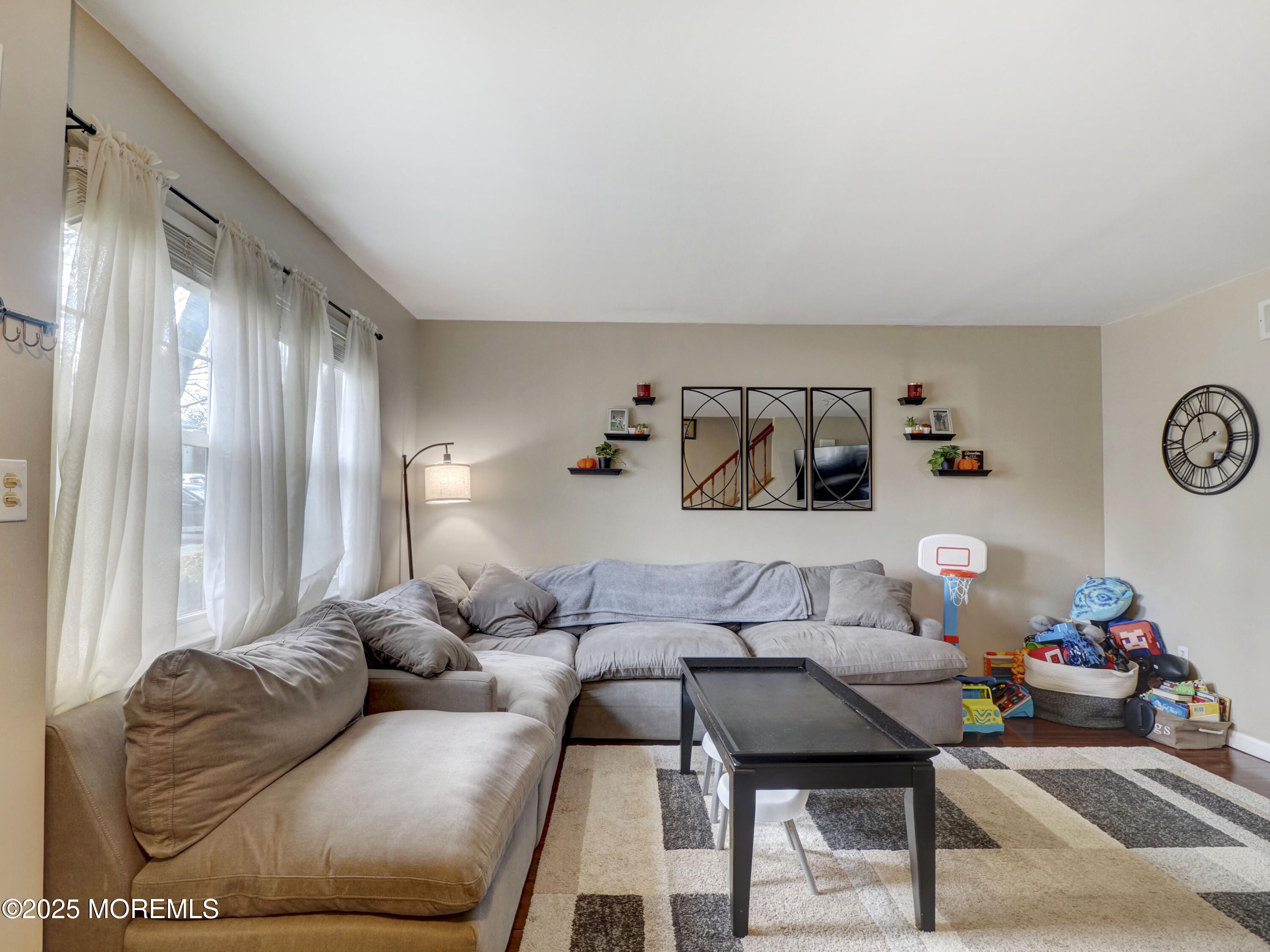 82 Cliffwood Avenue West, Unit 25D Cliffwood, NJ 07721 - Photo 8 of 27 a living room with furniture and a couch