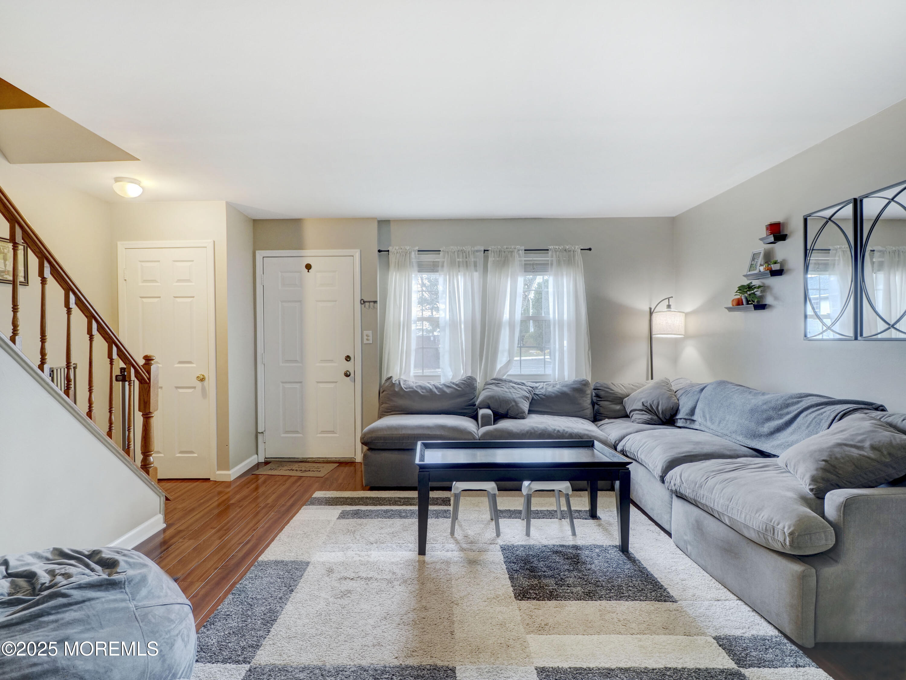 82 Cliffwood Avenue West, Unit 25D Cliffwood, NJ 07721 - Photo 9 of 27 a living room with furniture rug and a window