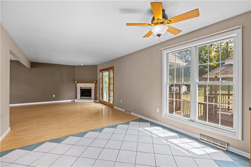 1552 Cathell Road Pittsburgh, PA 15236 - Photo 11 of 34 a view of an empty room with window and chandelier fan