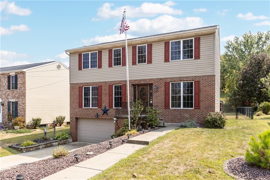 1552 Cathell Road Pittsburgh, PA 15236 - Photo 2 of 34 a front view of a house with garden