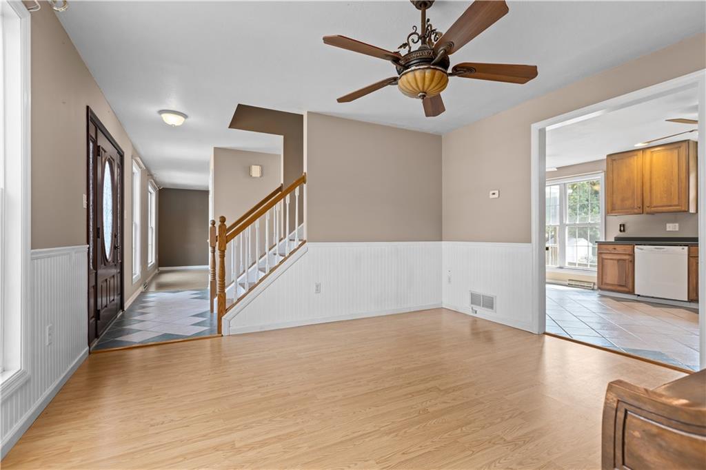 1552 Cathell Road Pittsburgh, PA 15236 - Photo 6 of 34 a view of a livingroom with wooden floor and a ceiling fan