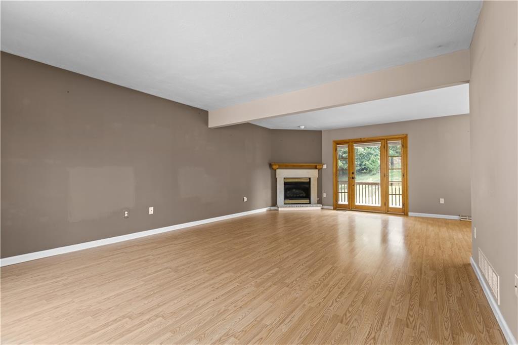 1552 Cathell Road Pittsburgh, PA 15236 - Photo 8 of 34 a view of an empty room with wooden floor and a window