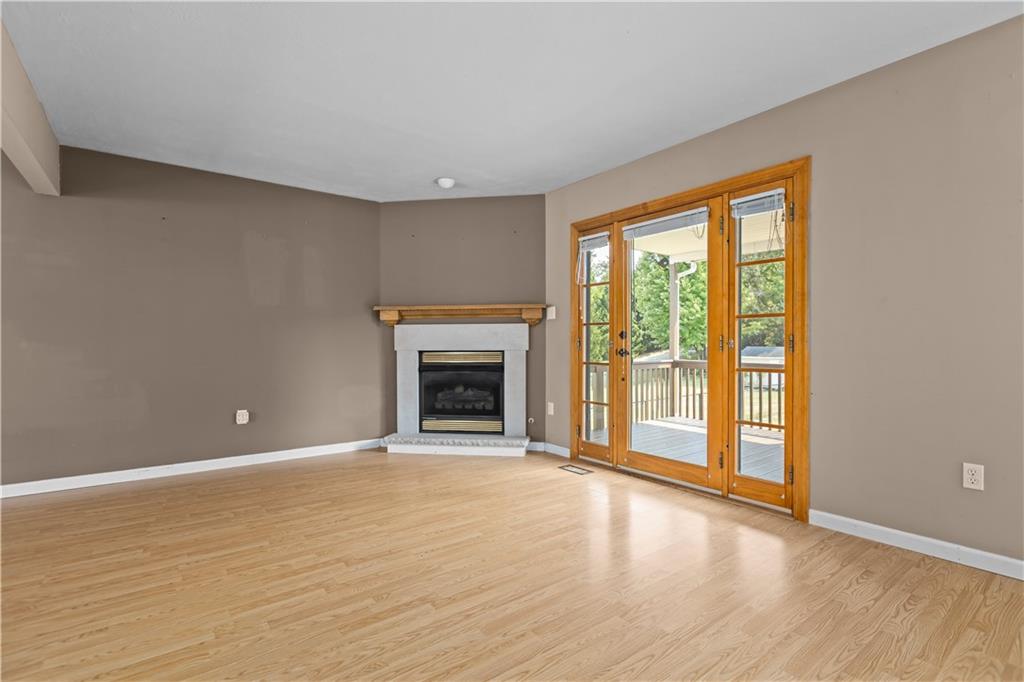 1552 Cathell Road Pittsburgh, PA 15236 - Photo 10 of 34 a view of an empty room with a fireplace and a window