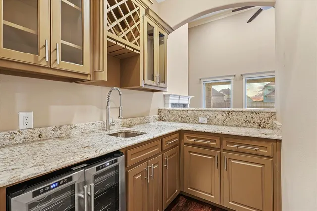 a kitchen with stainless steel appliances granite countertop a sink and dishwasher with cabinets