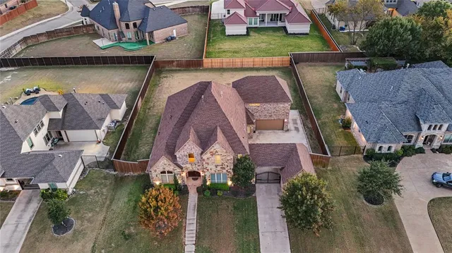 an aerial view of houses with outdoor space
