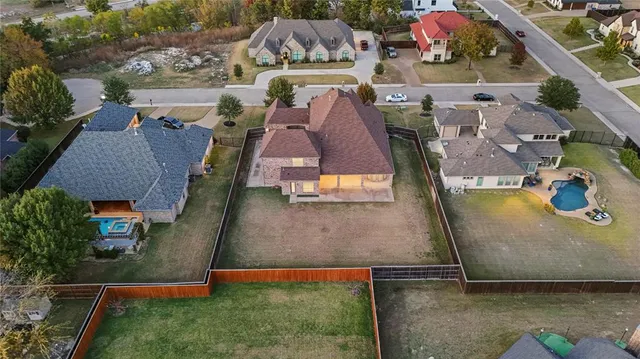 an aerial view of multiple houses with outdoor space