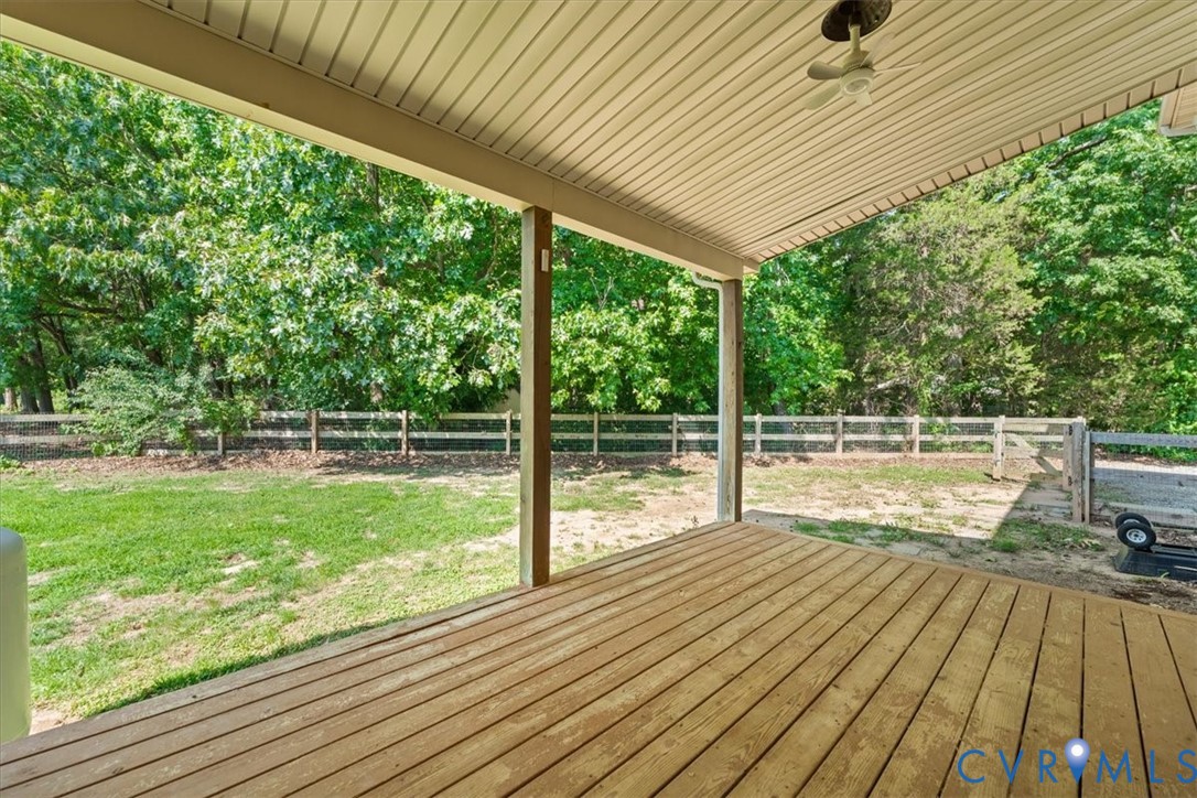 3137 Trenholm Road Powhatan, VA 23139 - Photo 54 of 72 a view of a deck with wooden floor and roof with a garden view