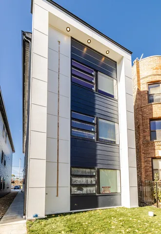 a view of a house with a large window