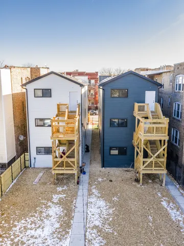 a view of a wooden chairs in the room