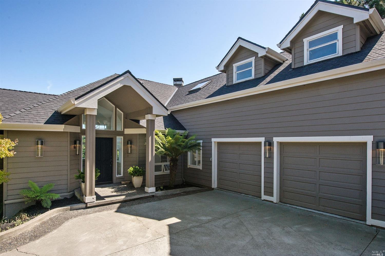 a front view of a house with garage