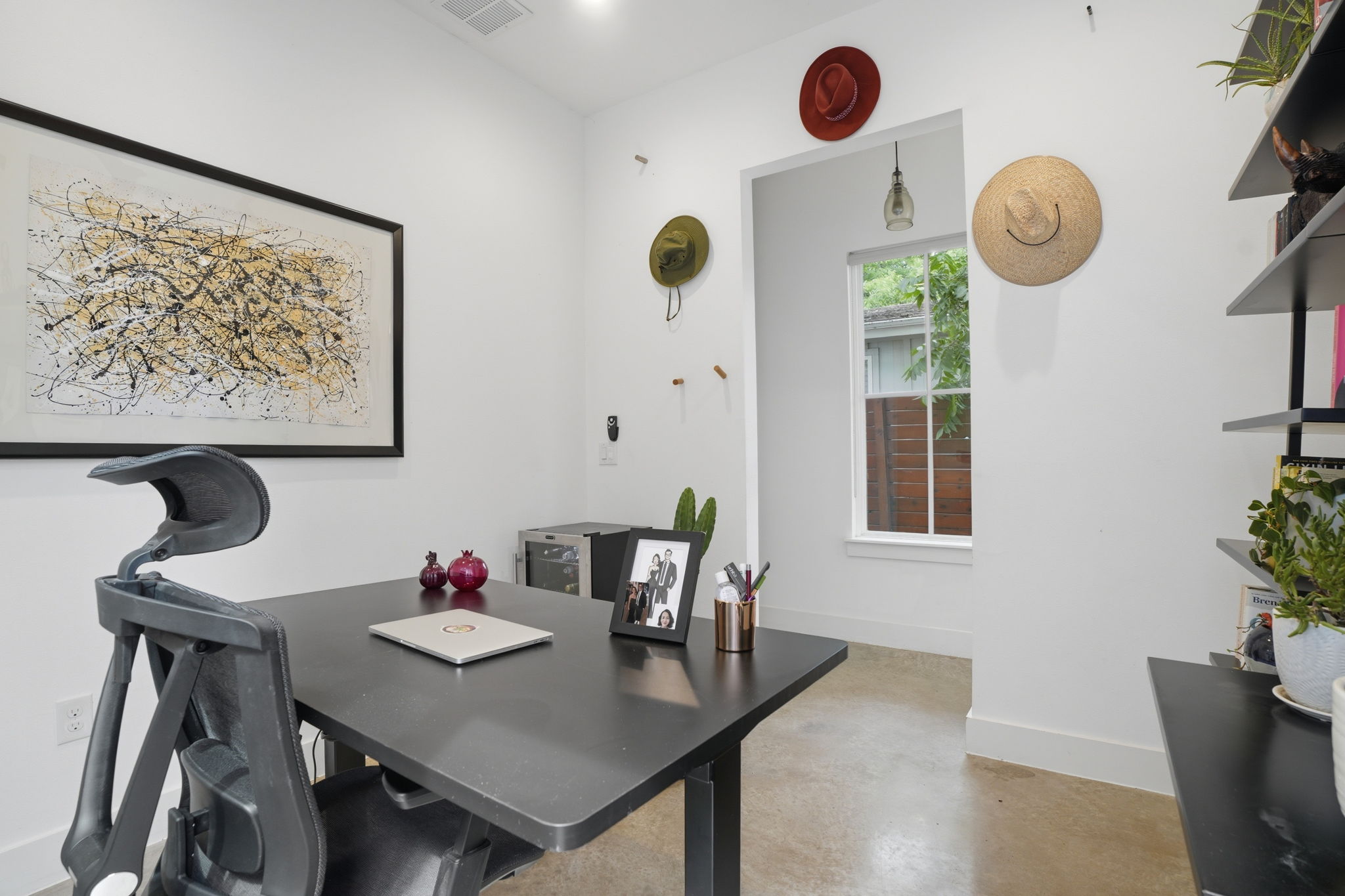 4609 Sara Drive, Unit B Austin, TX 78721 - Photo 8 of 39 An airy office space offers built-in shelving, ample natural light, and smooth concrete flooring.