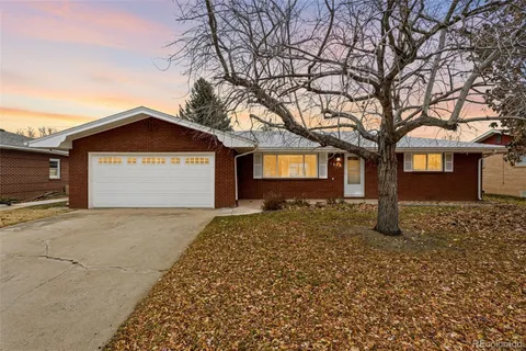 a view of a house with a yard and garage