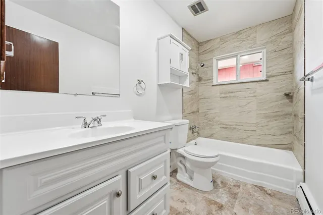 a bathroom with a sink a toilet and a bathtub