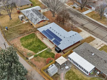 an aerial view of a house with a yard