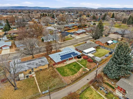 an aerial view of residential houses with outdoor space