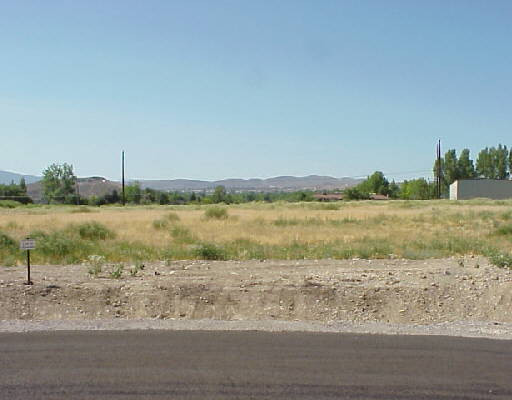 9 Lakeside Ranch Reno, NV 89511 - Photo 1 of 1 a view of a lake with a beach