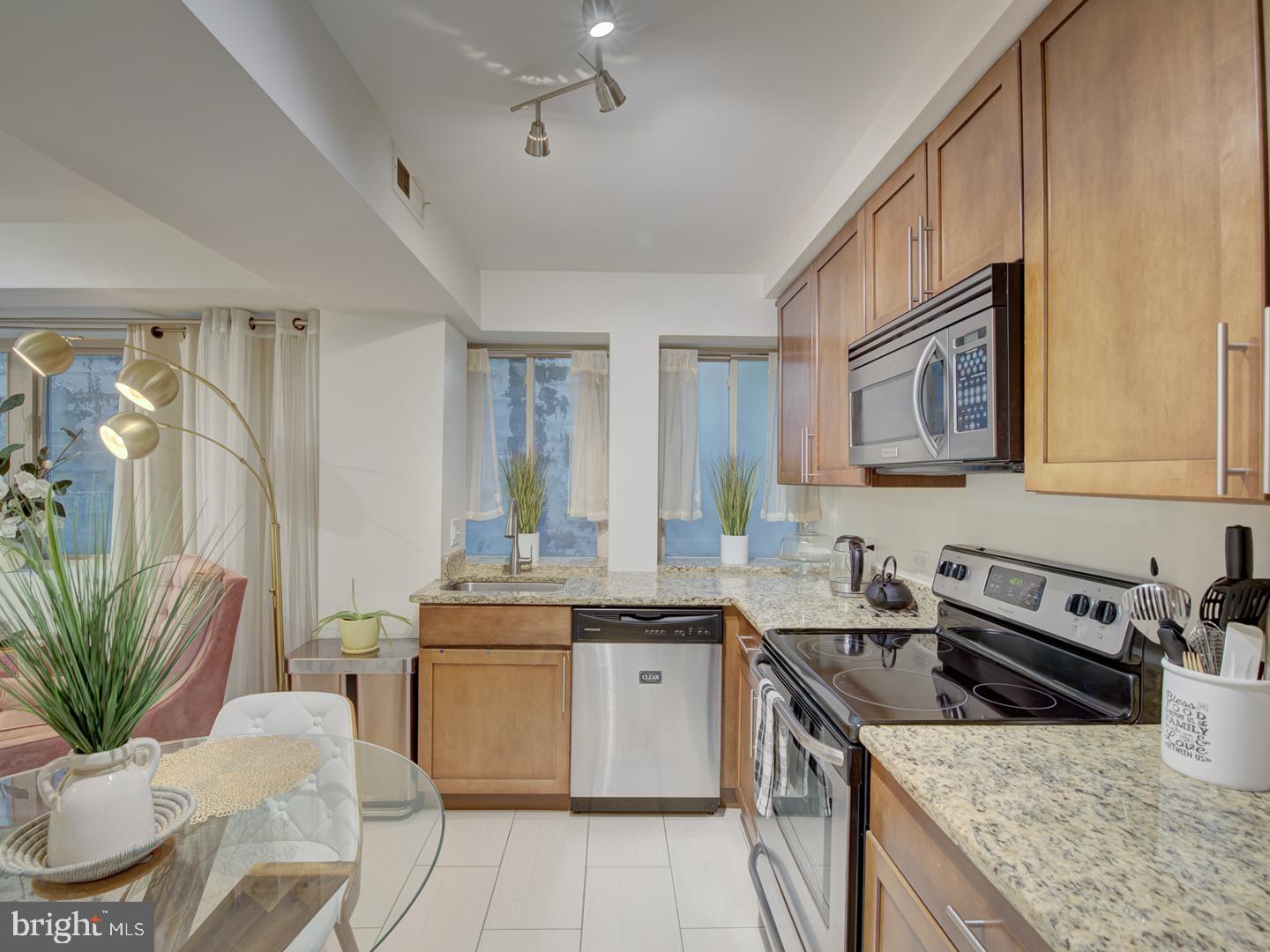 6425 14th Street Northwest, Unit B2 Washington, DC 20012 - Photo 17 of 53 a kitchen with a sink stove and cabinets