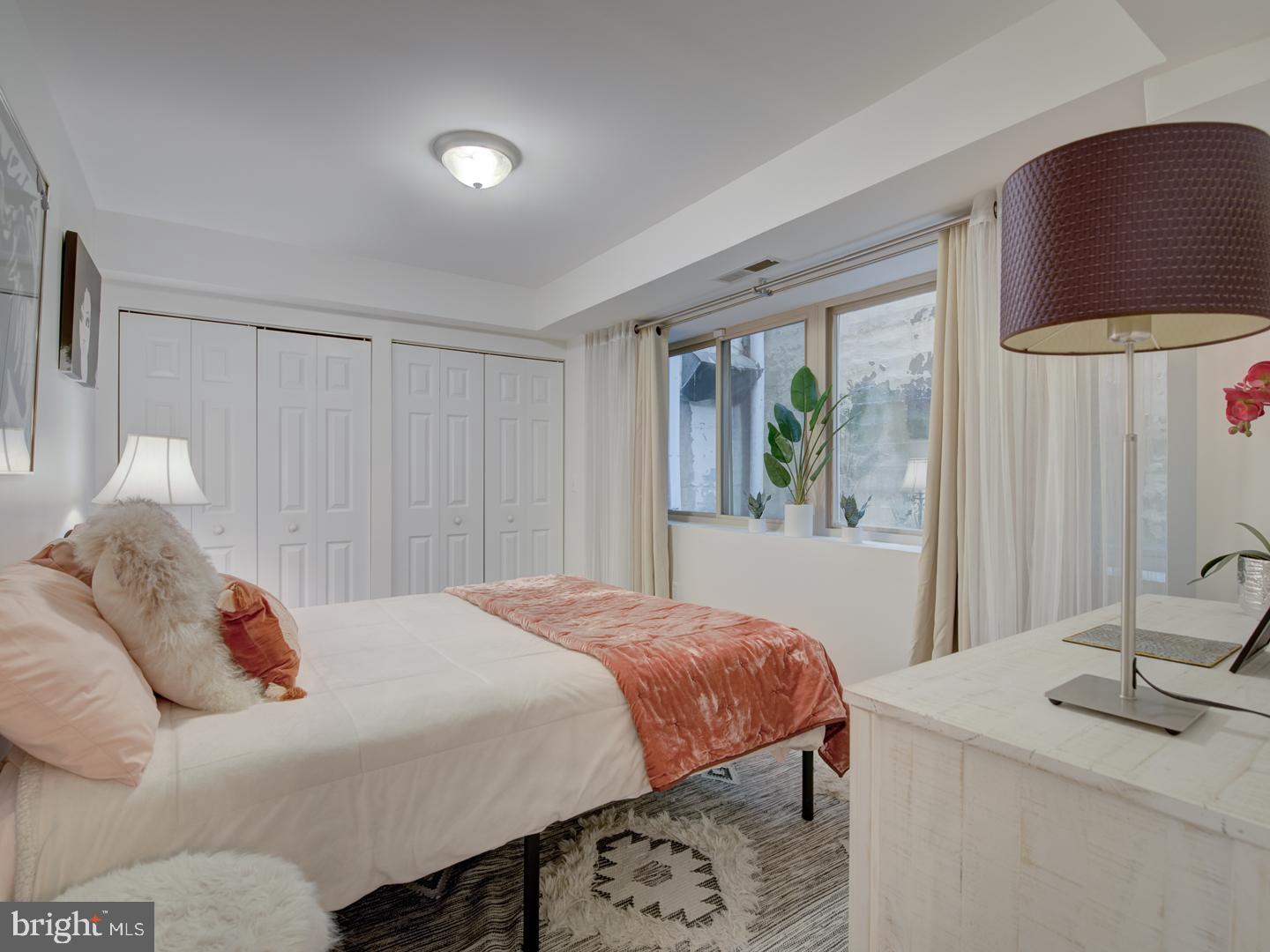 6425 14th Street Northwest, Unit B2 Washington, DC 20012 - Photo 26 of 53 a bedroom with a bed and a table in it