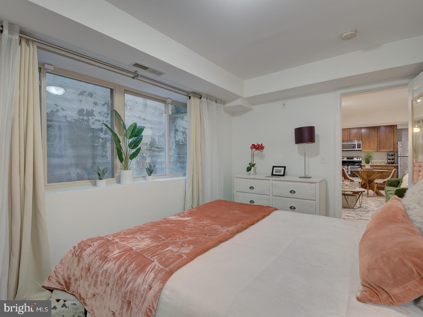 6425 14th Street Northwest, Unit B2 Washington, DC 20012 - Photo 29 of 53 a bedroom with a bed and a large window