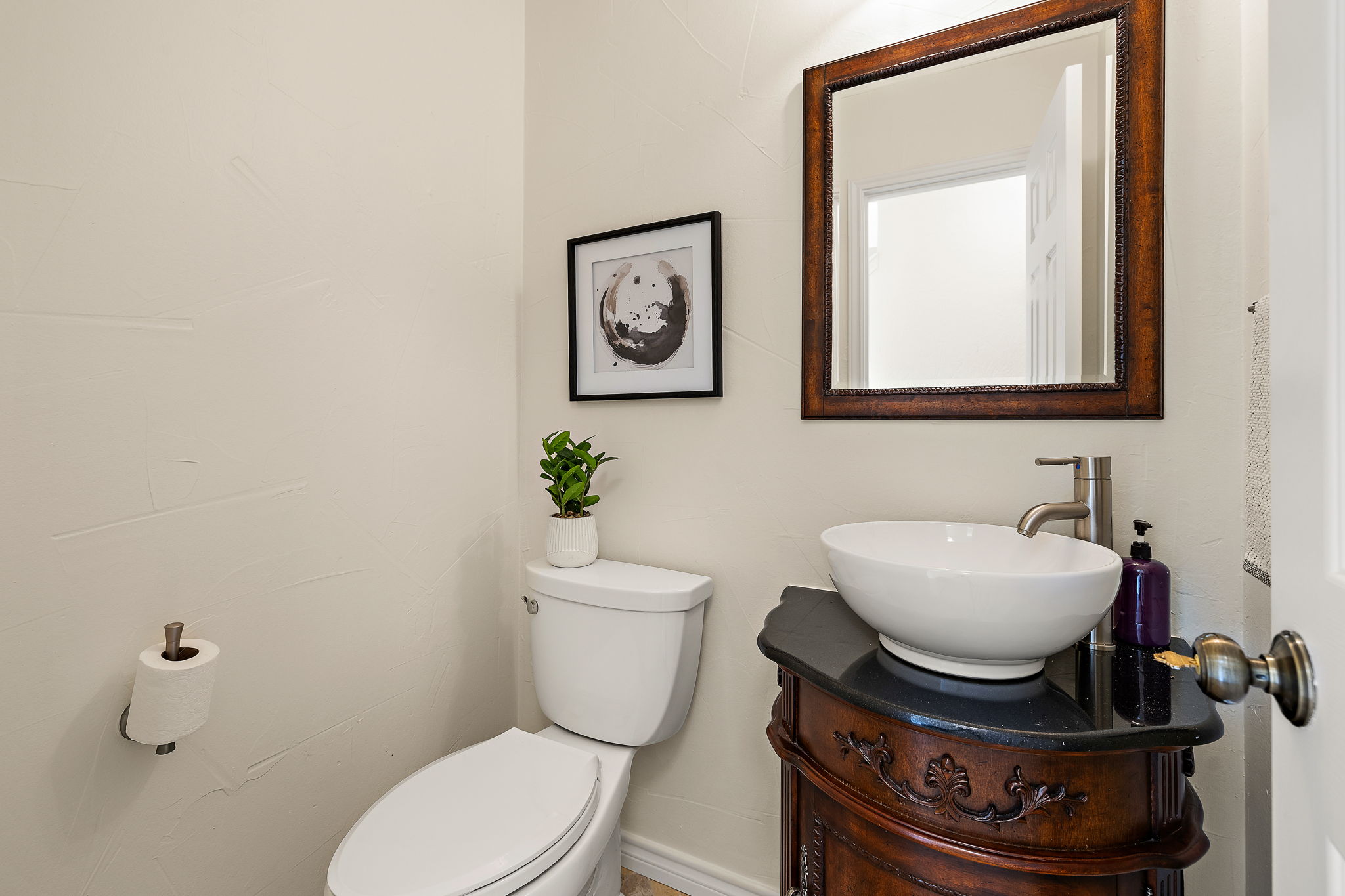 9002 Bancroft Trail Austin, TX 78729 - Photo 18 of 35 Half bathroom for guests in hallway off of the foyer.