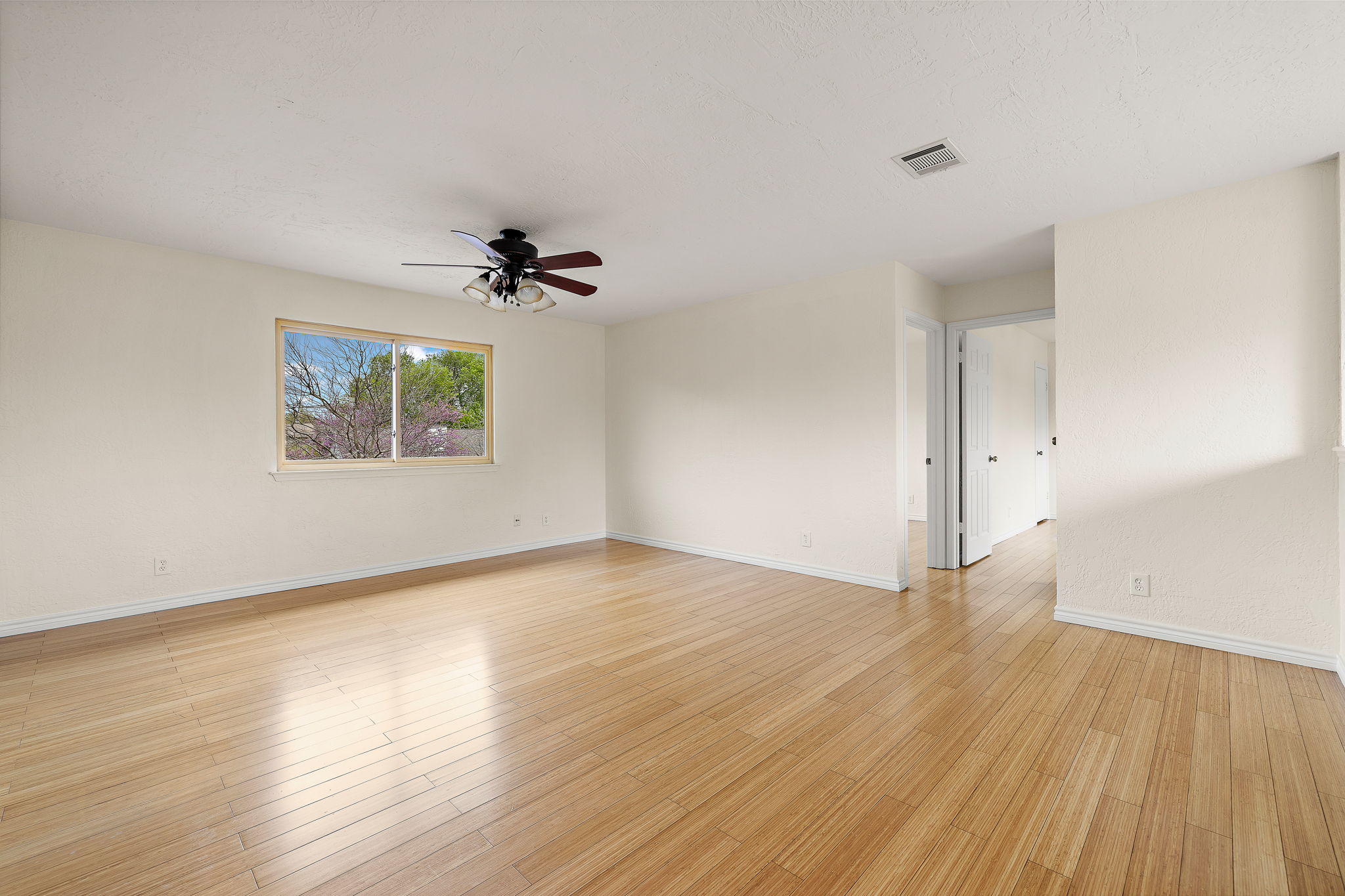 9002 Bancroft Trail Austin, TX 78729 - Photo 26 of 35 View of the second living area looking toward the hallway to two of the three upstairs bedrooms. This versatile space could be a game room, family room, craft room, workout room, media room, etc.
