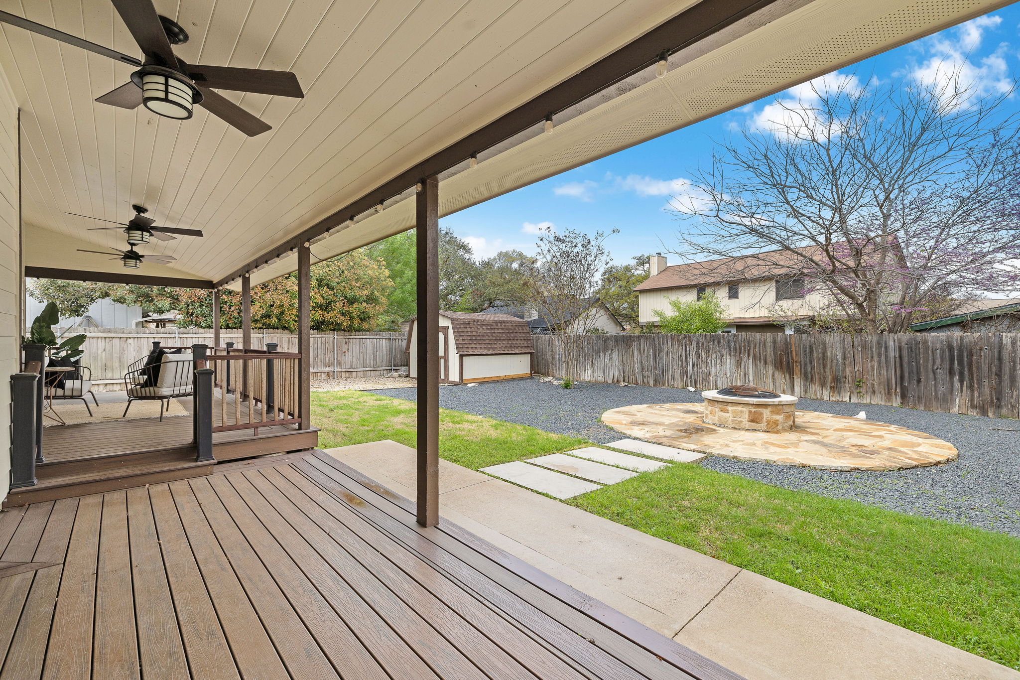 9002 Bancroft Trail Austin, TX 78729 - Photo 27 of 35 Awesome extended composite decking is covered for ultimate outdoor enjoyment.