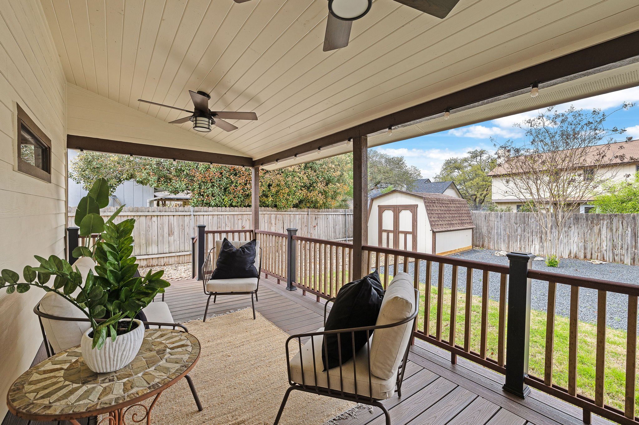 9002 Bancroft Trail Austin, TX 78729 - Photo 28 of 35 Awesome extended composite decking is covered for ultimate outdoor enjoyment. Note one of the two sheds in the backgound.