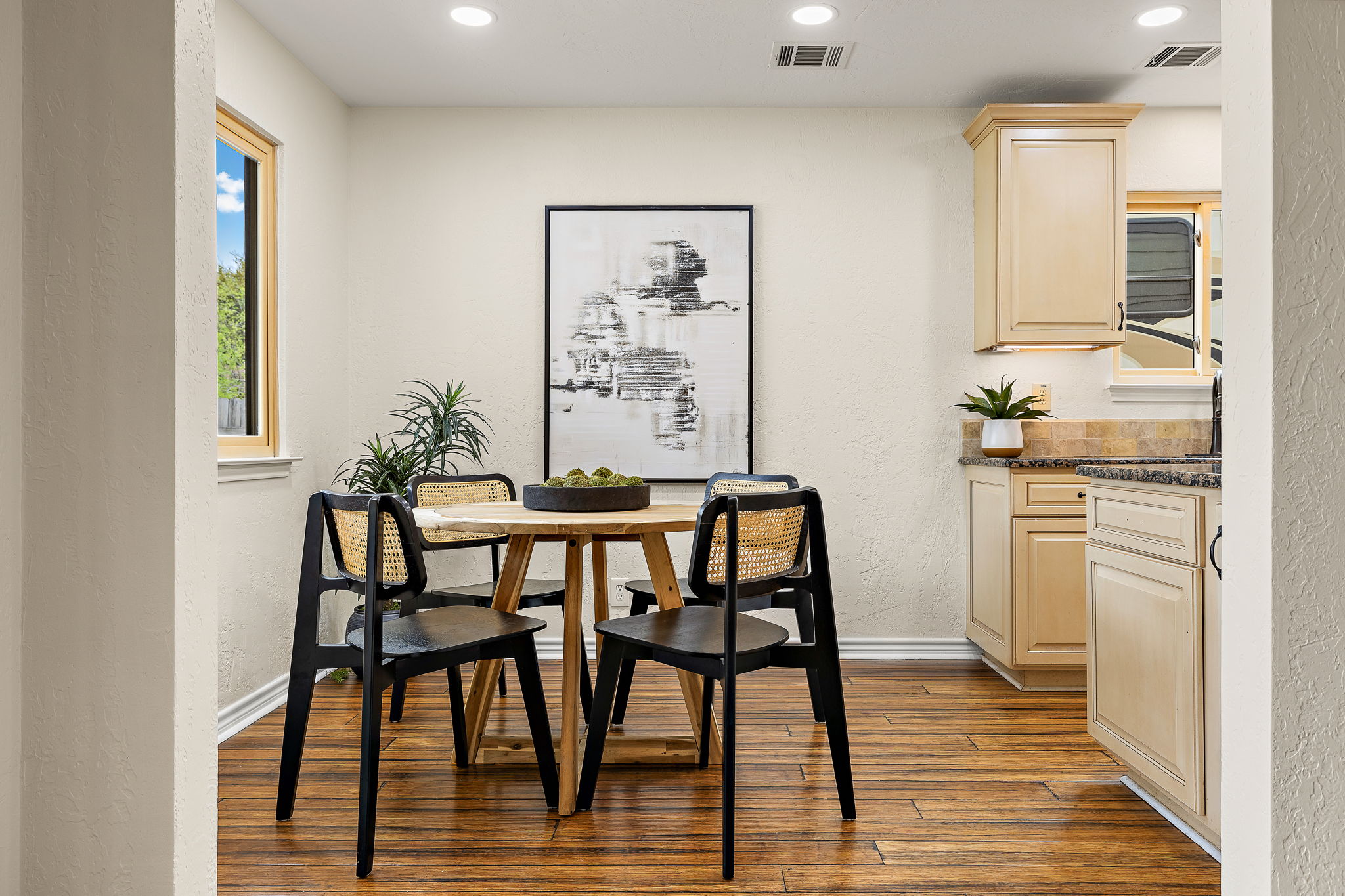 9002 Bancroft Trail Austin, TX 78729 - Photo 10 of 35 Kitchen has a sweet breakfast area looking out to the backyard.