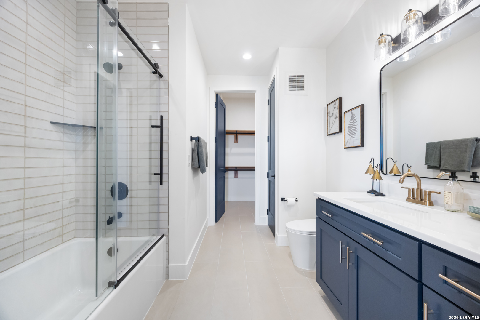 10899 South Hausman Road, Unit 207 San Antonio, TX 78249 - Photo 11 of 24 a bathroom with a tub sink double vanity and a shower