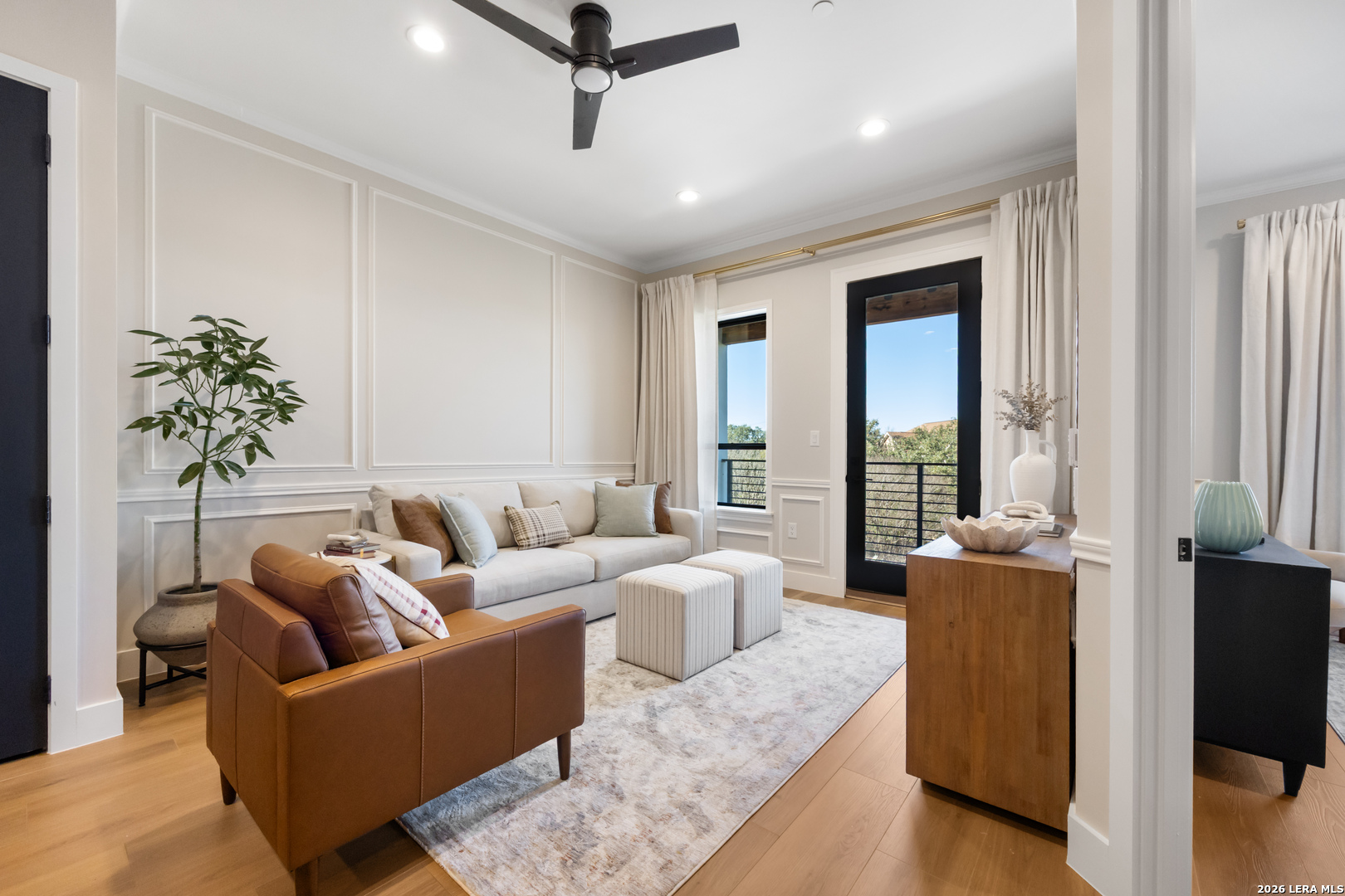 10899 South Hausman Road, Unit 207 San Antonio, TX 78249 - Photo 7 of 24 a living room with furniture and a large window
