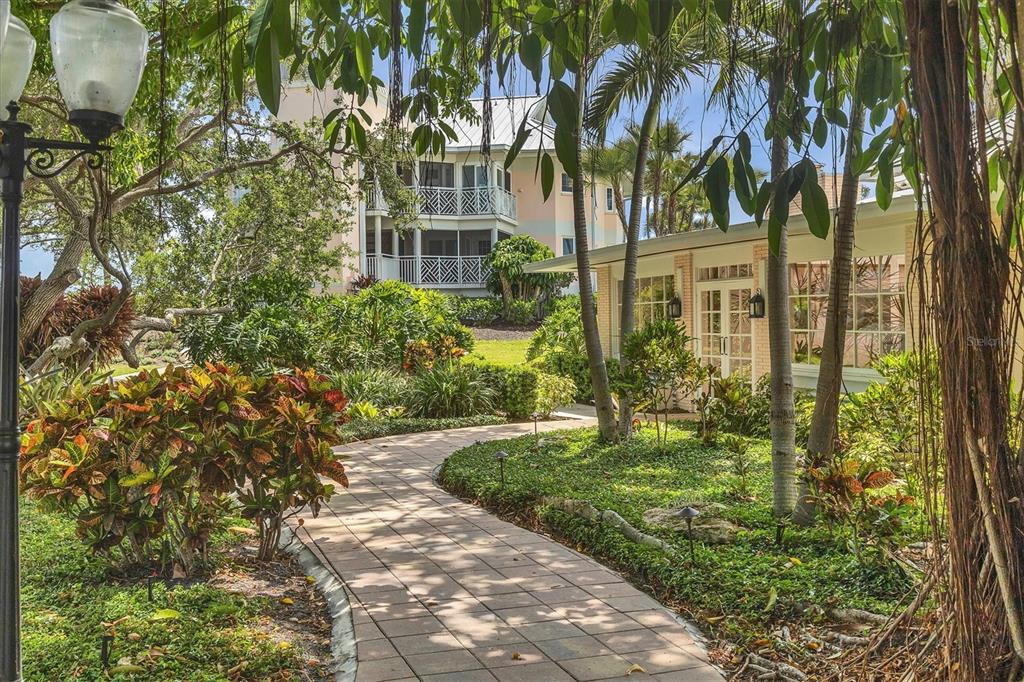 11000 Placida Road, Unit 302 Placida, FL 33946 - Photo 35 of 68 a view of a garden with a tree