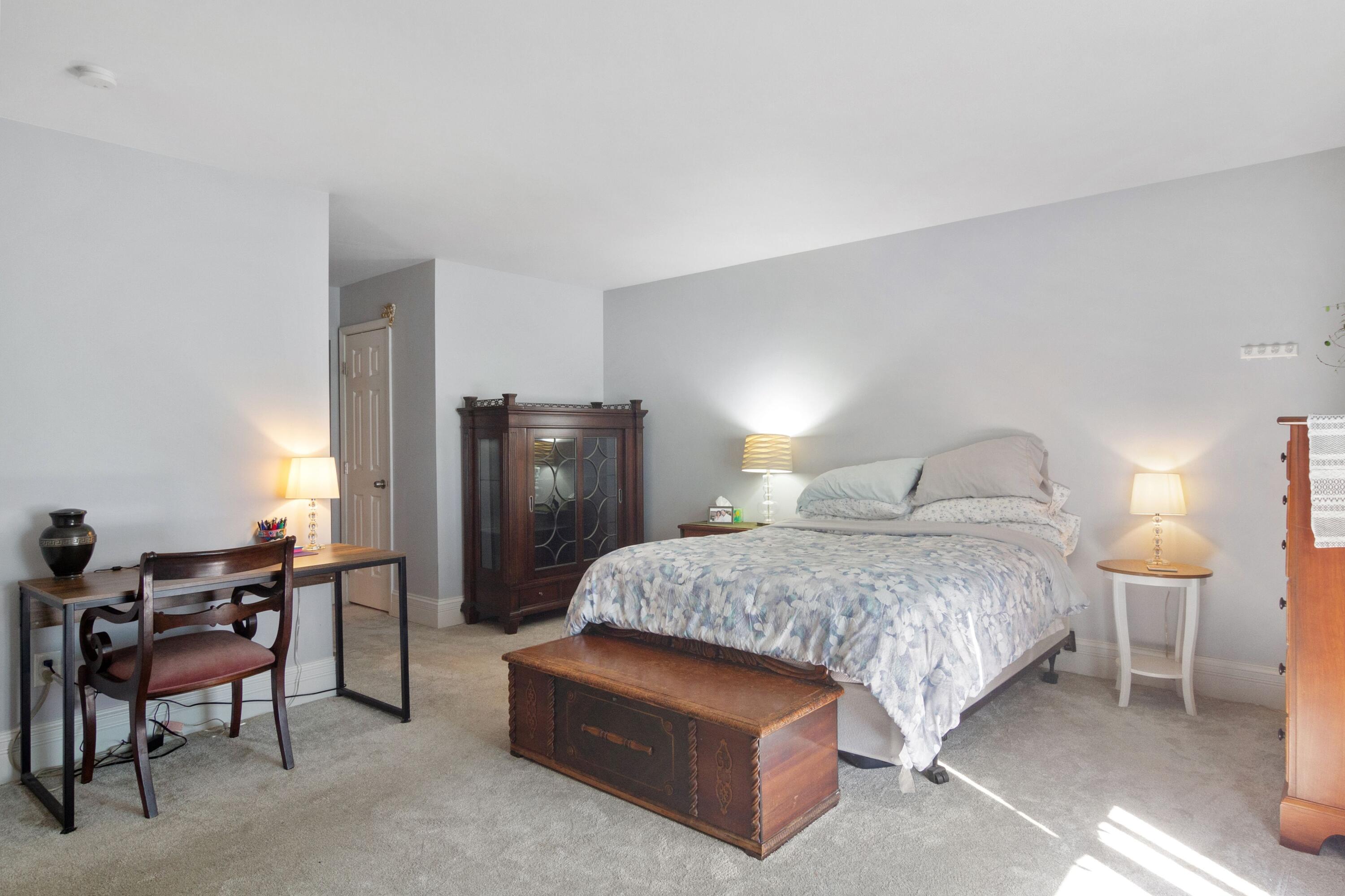 1847 Springvale Drive Crown Point, IN 46307 - Photo 12 of 22 a bedroom with a bed and chair