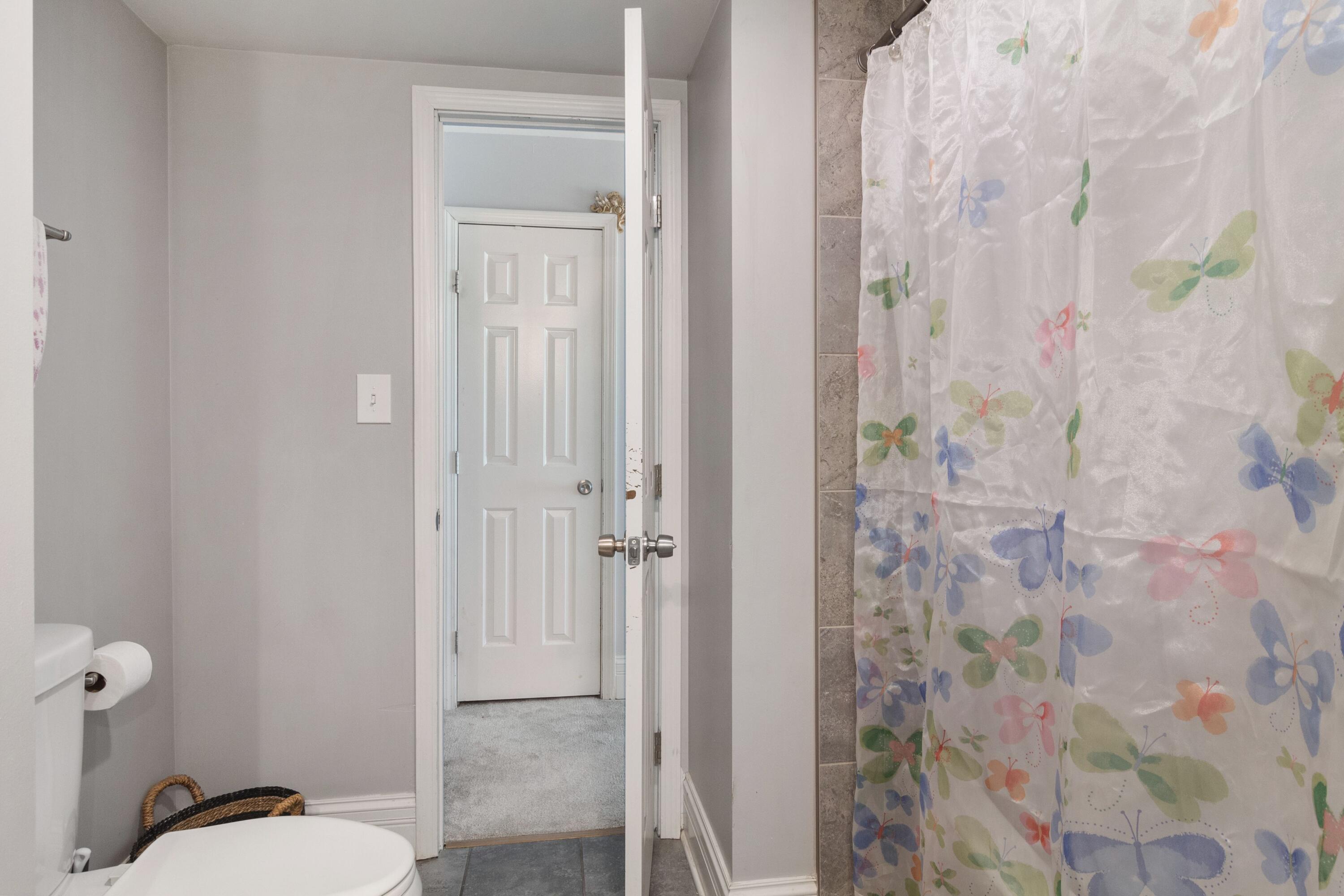 1847 Springvale Drive Crown Point, IN 46307 - Photo 14 of 22 a bathroom with a granite countertop toilet and a shower
