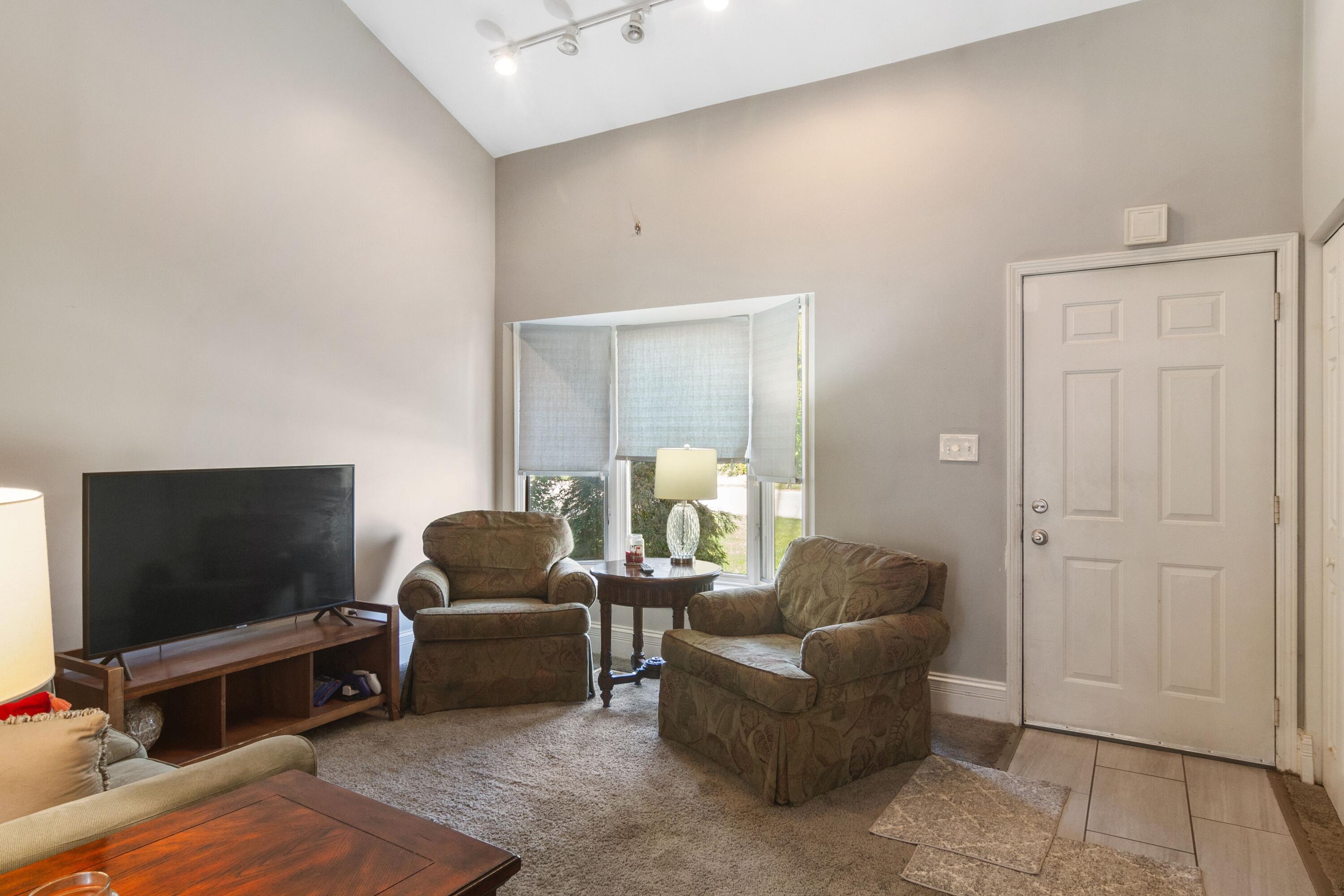 1847 Springvale Drive Crown Point, IN 46307 - Photo 2 of 22 a living room with furniture and a flat screen tv