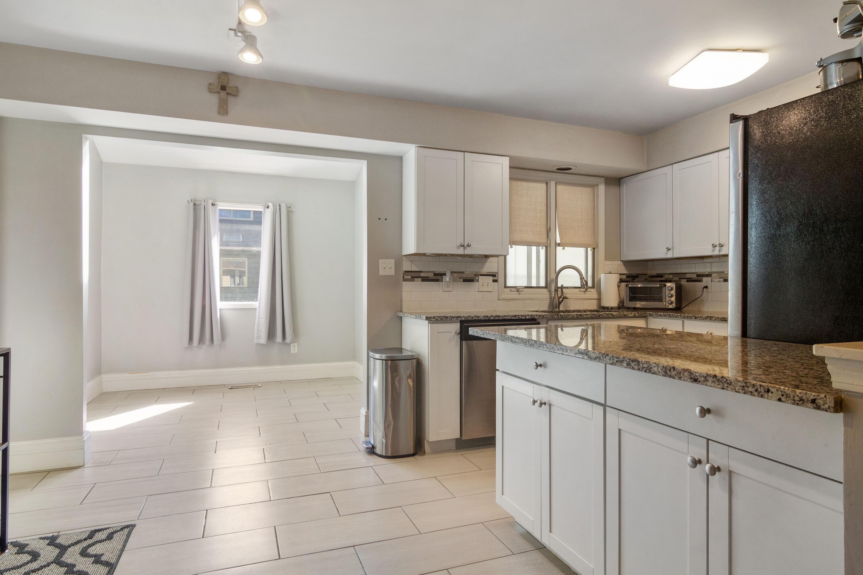 1847 Springvale Drive Crown Point, IN 46307 - Photo 6 of 22 a kitchen with stainless steel appliances granite countertop a stove a sink and a refrigerator