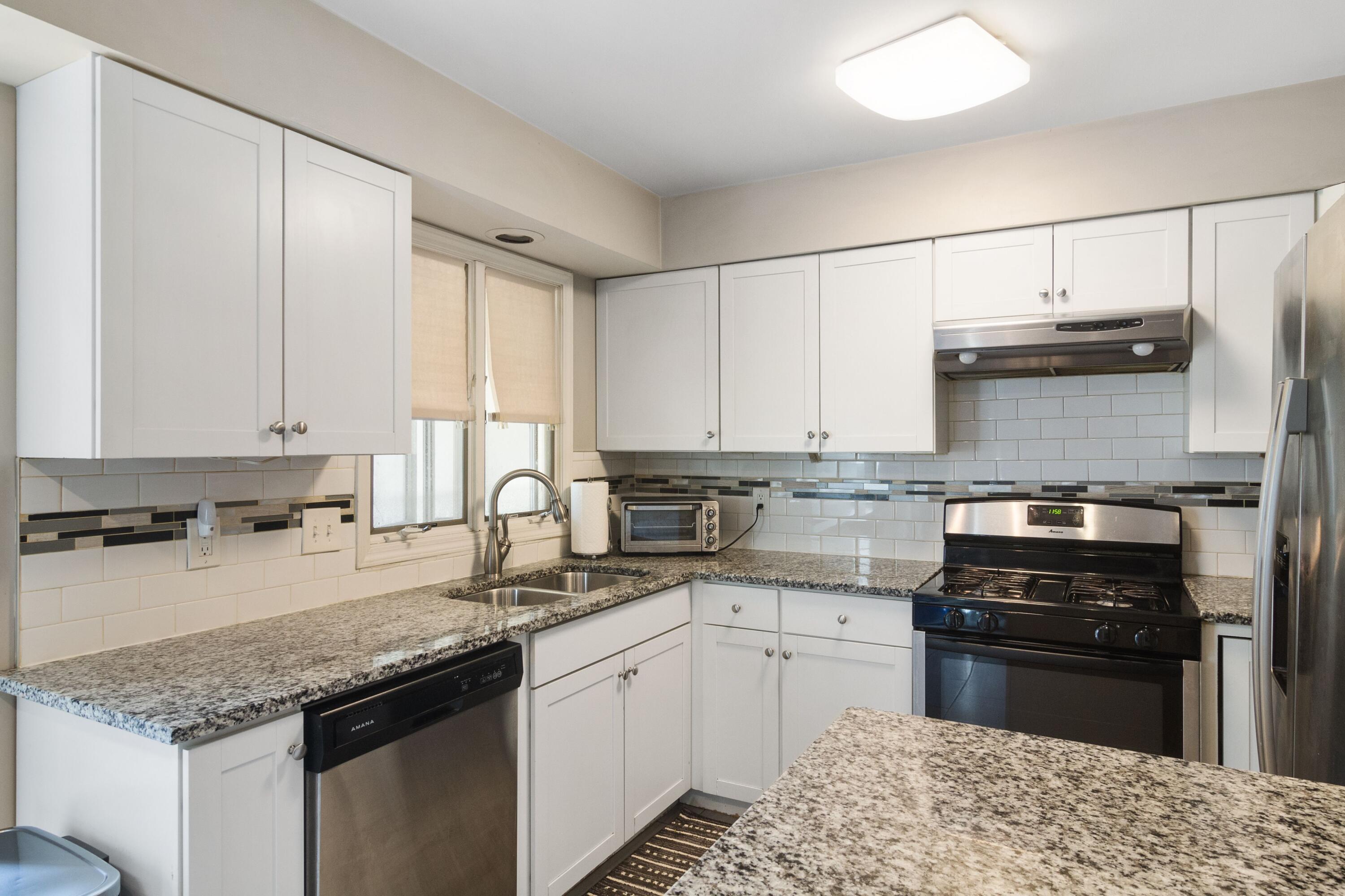 1847 Springvale Drive Crown Point, IN 46307 - Photo 7 of 22 a kitchen with stainless steel appliances granite countertop a sink stove and refrigerator